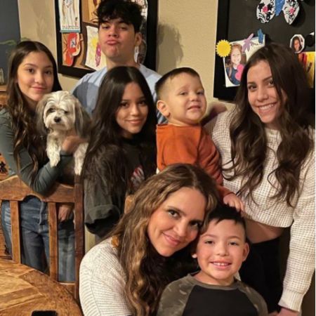 Jenna Ortega and her family took a picture together in their kitchen. 
